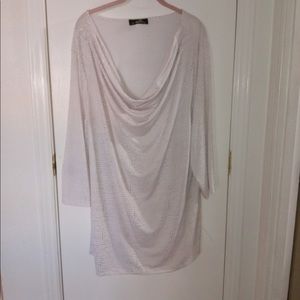 Gorgeous blouse with very unusual collar, it drapes down beautifully.